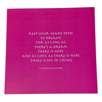 A square magenta pink card or print featuring a white handwritten-style quote about hope and joy, with 'UNKNOWN AUTHOR' printed at the bottom.