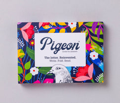 Colorful box with floral design and 'Pigeon' branding on a gray background