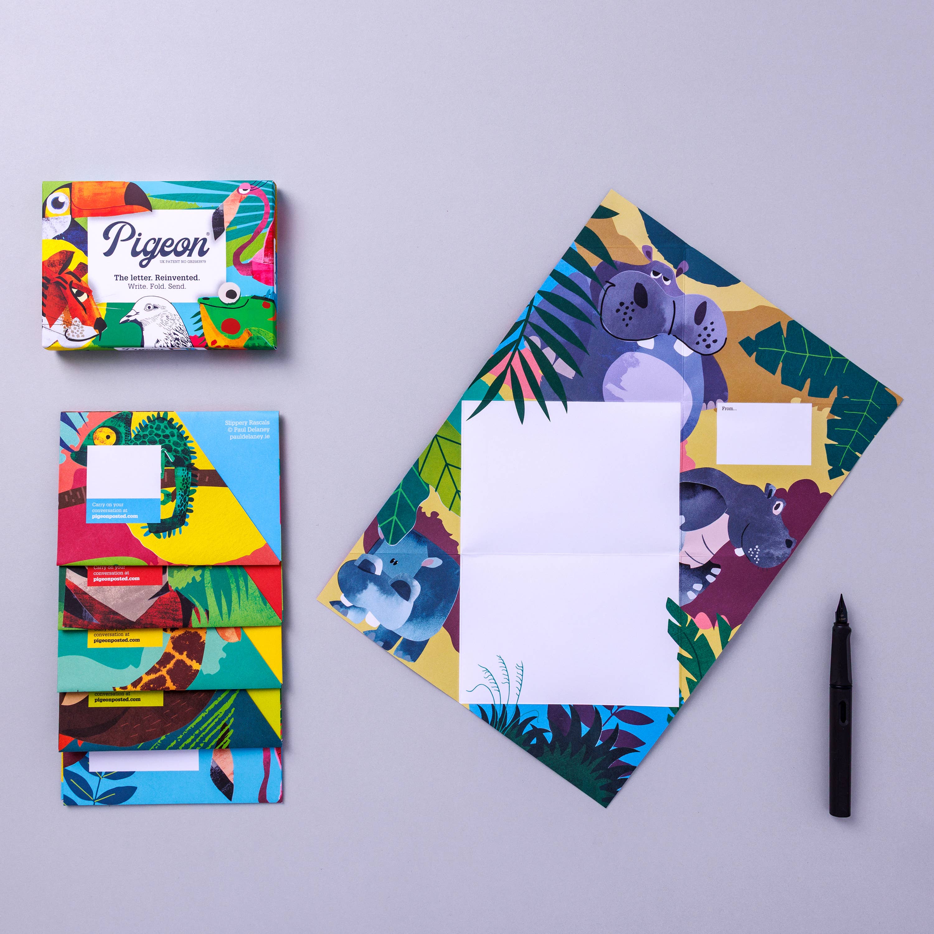 Colorful stationery set with animal designs on a gray background
